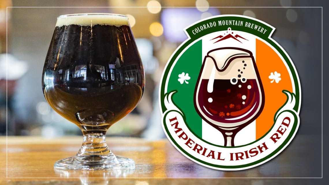 Glass of dark Imperial Irish Red ale with creamy head next to Colorado Mountain Brewery logo.
